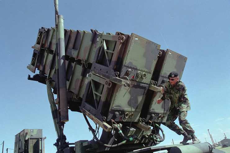 Soldier standing behind an MIM-104 Patriot