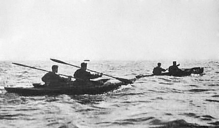 British commandos operating two canoes