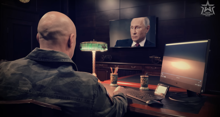 Denis Maidanov watching a televised speech by Russian President Vladimir Putin