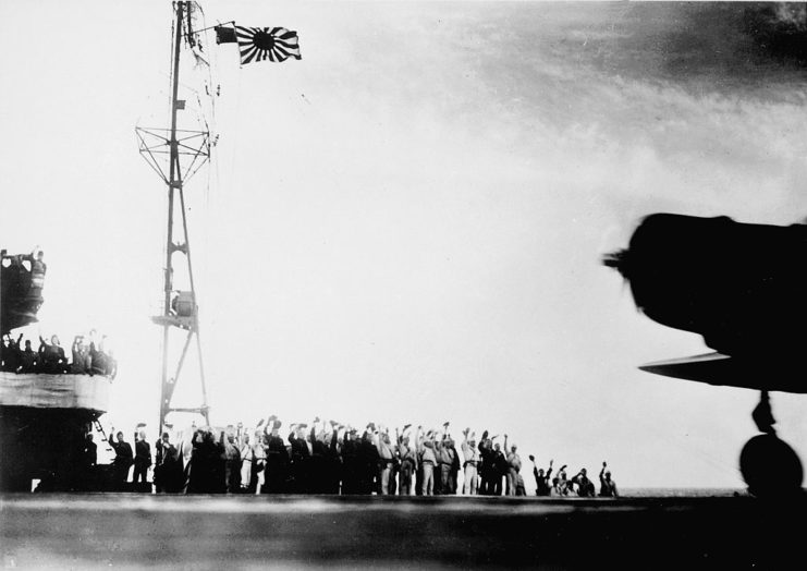 Nakajima B5N2 and Japanese personnel standing on the deck of the aircraft carrier Shōkaku