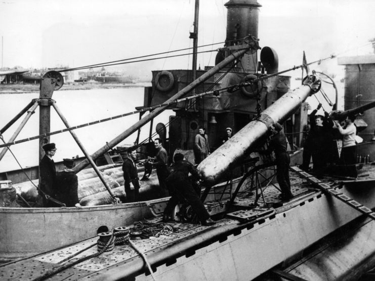 Crewmen handling torpedoes on the ORP Sokół