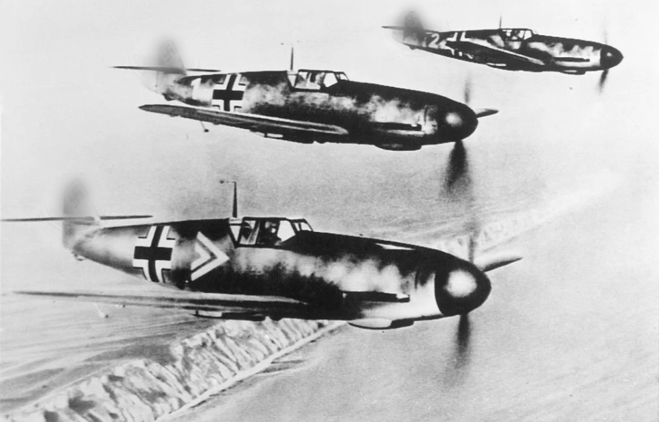 Three Messerschmitt Bf 109s in flight