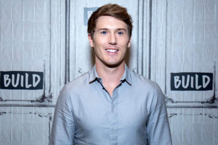 Spencer Treat Clark standing on a red carpet
