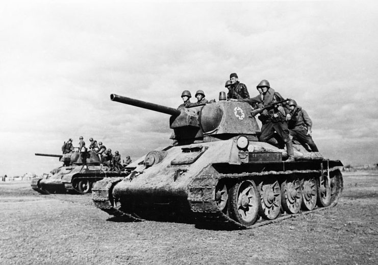 Red Army soldiers riding aboard two T-34s
