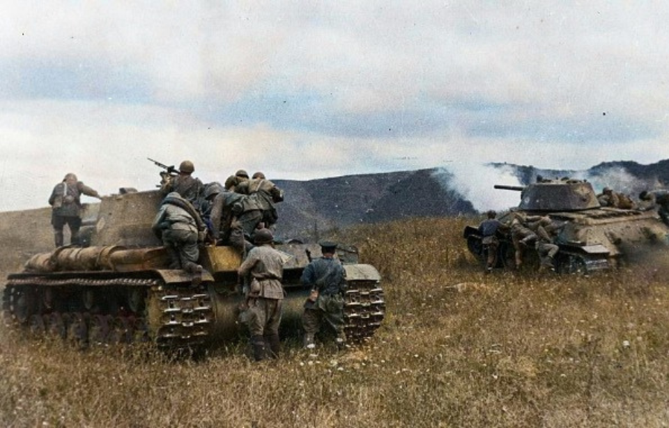 Red Army soldiers stood atop T-34s