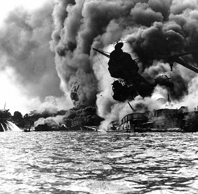 USS Arizona (BB-39) shrouded in smoke