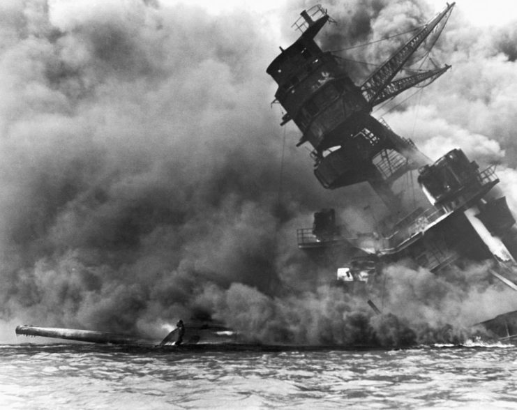 USS Arizona (BB-39) shrouded in smoke