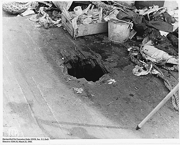 Close-up of a bomb hole on the deck of the USS California (BB-44)