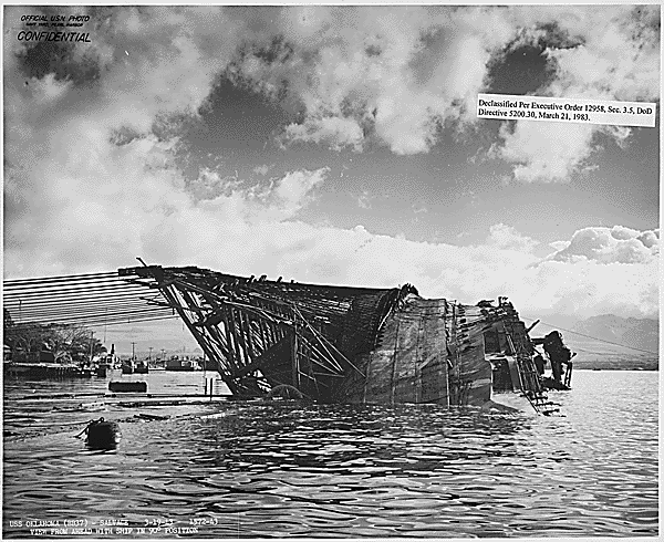 Wreck of the USS Oklahoma (BB-37) sticking out of the water