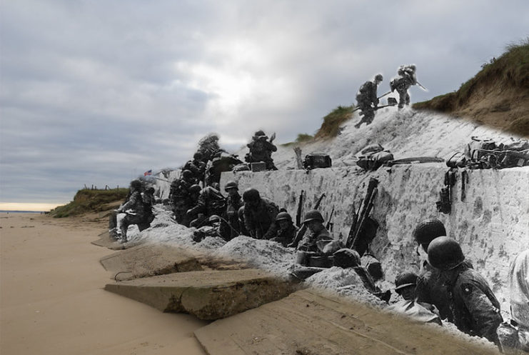 Members of the 8th Infantry Regiment, 4th Infantry Division climbing over the seawall at Utah Beach