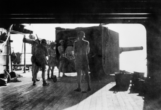 Five Australian soldiers manning a six-inch gun aboard the RMS Laconia (1921)