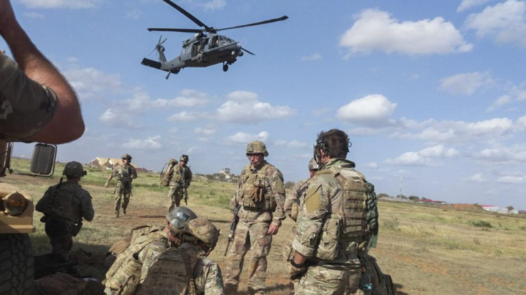 Sikorsky HH-60G Pave Hawk hovering over members of Charlie Troop, 1st Squadron, 102nd Cavalry Regiment, New Jersey Army National Guard