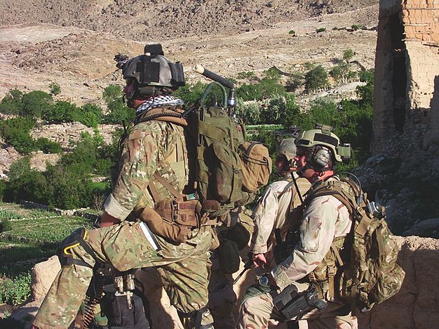 Three members with the 3rd Special Forces Group standing in Shok Valley