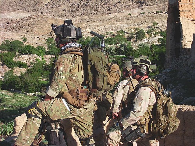 Three members with the 3rd Special Forces Group standing in Shok Valley