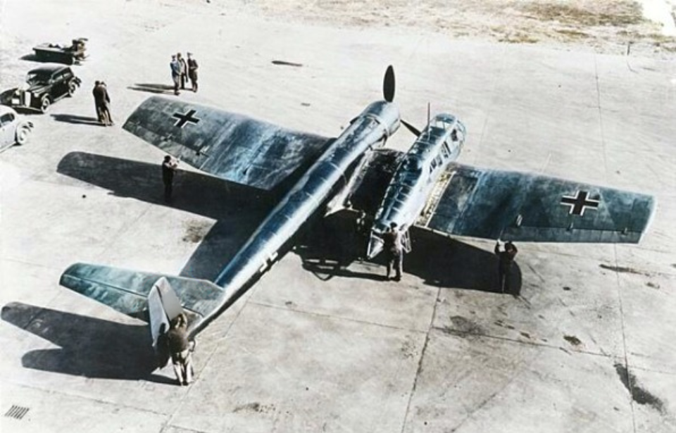 Ground crews standing around a Blohm & Voss BV 141 parked on a runway