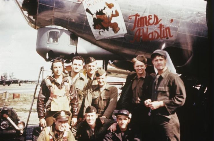 Crew of the Boeing B-17G Flying Fortress 'Times A-Wastin' standing near the aircraft