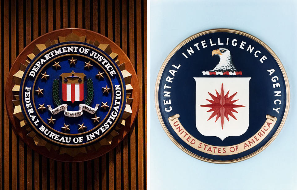 FBI logo on a wooden wall + CIA logo against a pale blue backdrop