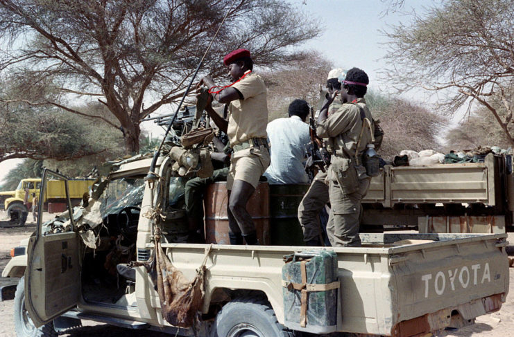 Members of the Chadian Armed Forces (FANT) stand behind a Toyota pickup truck