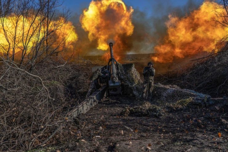 Ukrainian soldier firing an artillery weapon on the battlefield