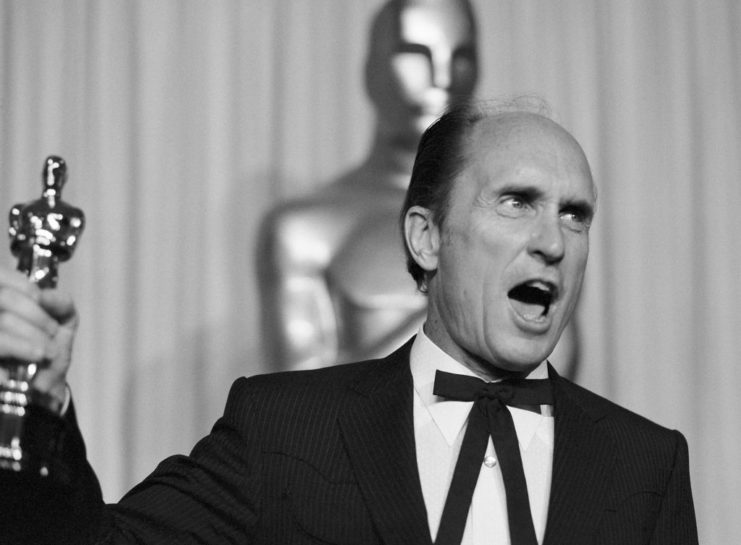 Robert Duvall holding his Academy Award