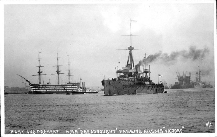 HMS Dreadnought (1906) sailing by the HMS Victory