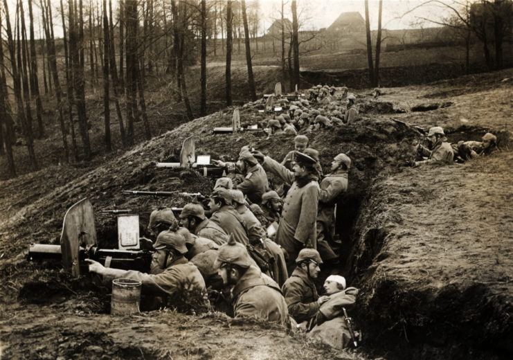 German soldiers manning machine guns in a trench