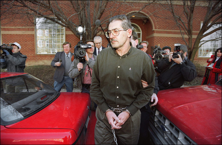 Aldrich Ames being led away from a US Federal Courthouse in handcuffs