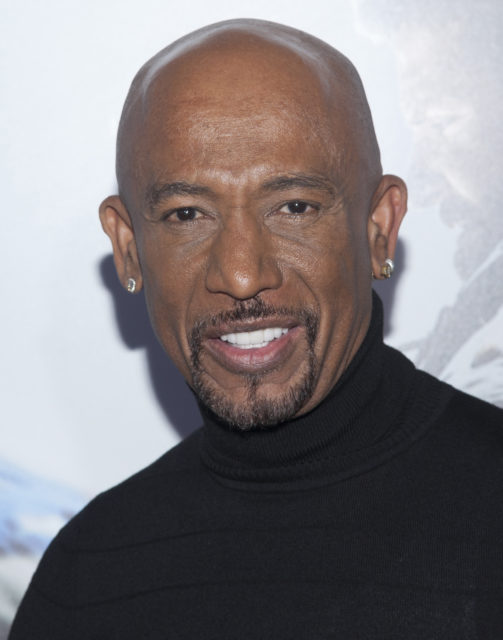 Montel Williams posing on a red carpet