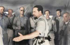 Italo Balbo speaking to a group of men.