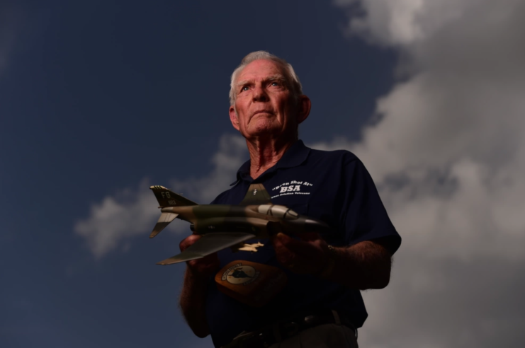 John "Bob" Pardo holding a replica of a McDonnell Douglas F-4 Phantom II