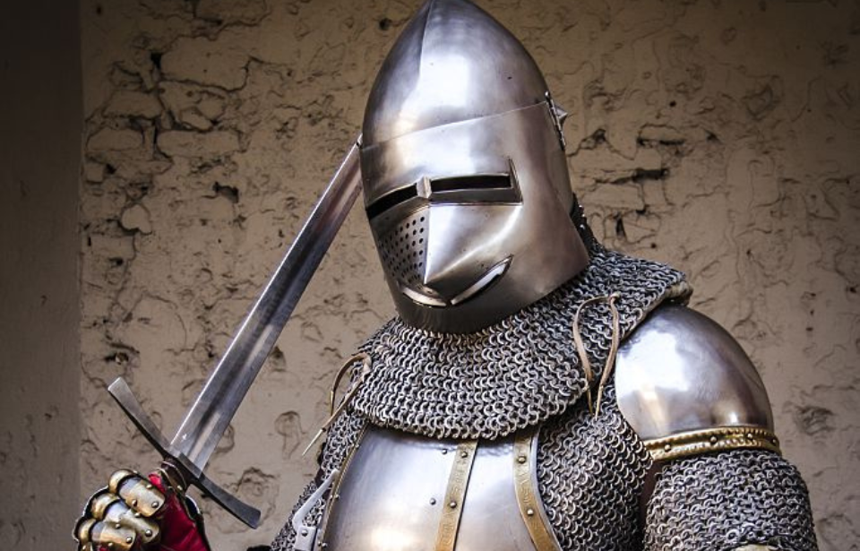 Re-enactor dressed in medieval-era armor