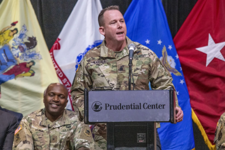 Lt. Col. Richard Karcher speaking at a podium