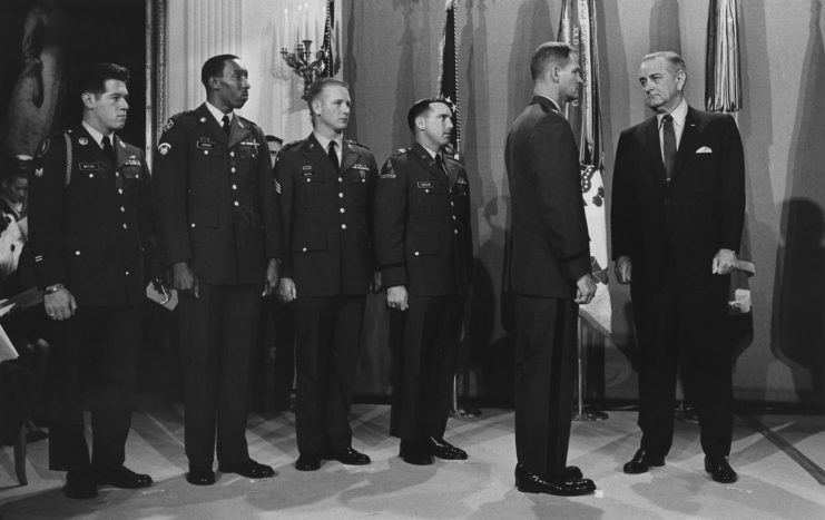 Lyndon B. Johnson standing with Gary Wetzel, Sammy L. Davis, Dwight H. Johnson, Angelo Liteky and James Allen Taylor