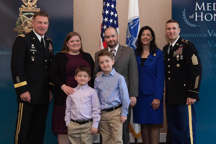 Staff Sgt. Ronald J Shurer II standing with his wife and sons, Vice Chief of Staff of the US Army Gen. James C. McConville, Holly Dailey and Sergeant Major of the Army Daniel A. Dailey