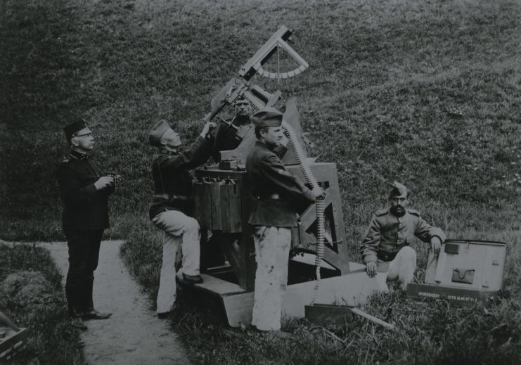 Five soldiers aiming a Schwarzlose MG toward the sky