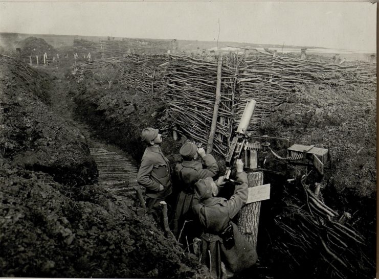 Three soldiers manning a Schwarzlose MG in a trench