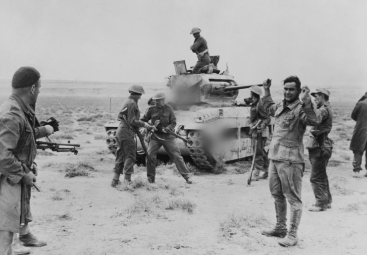 New Zealand soldiers surrounding members of the 15th Panzer Division in the desert