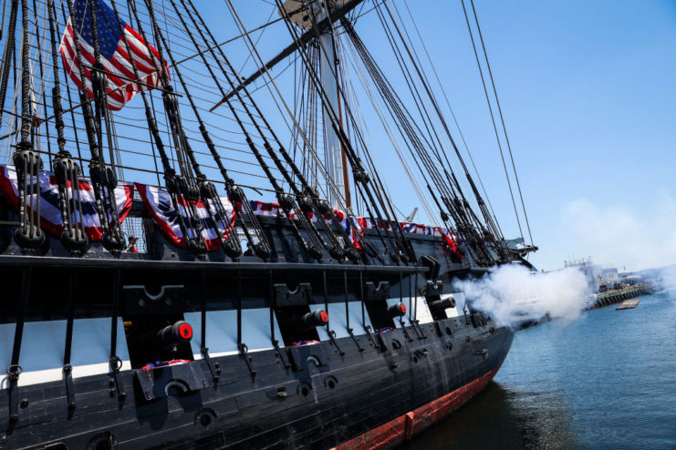 USS Constitution performing a 21-gun salute