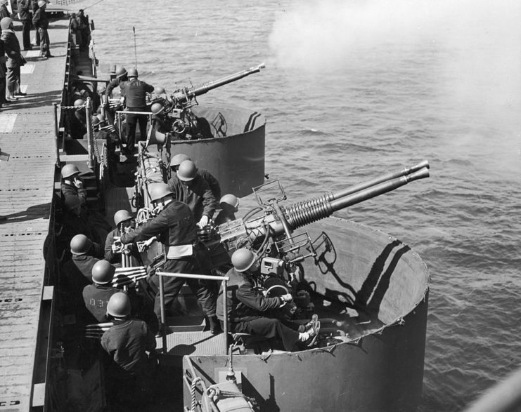 Crewmen aboard the USS Independence (CVL-22) firing her Bofors 40 mm Automatic Gun L/60s