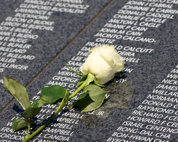 White rose placed atop the Wall of Remembrance at the Korean War Veterans Memorial