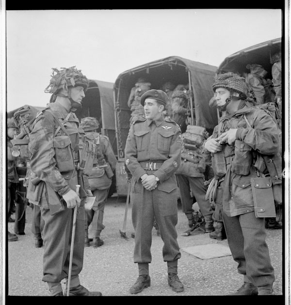 Members of the 1st Canadian Parachute Battalion standing behind military trucks