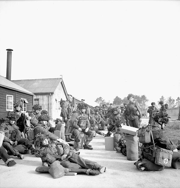Members of the 1st Canadian Parachute Battalion gathered outside a transit depot