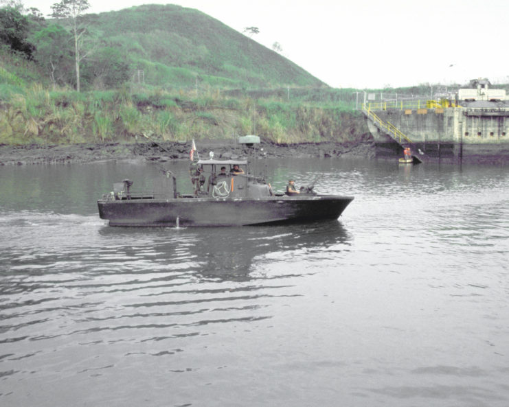 Members of Special Boat Unit 26 (SBU-26) in a Patrol Boat, River (PBR)