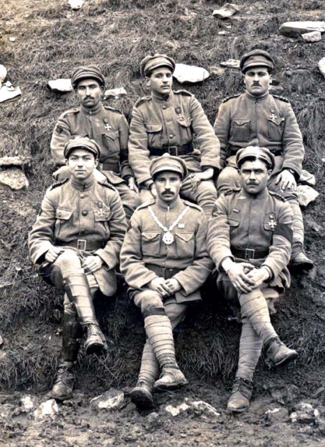 Aníbal Augusto Milhais sitting with five other Portuguese soldiers