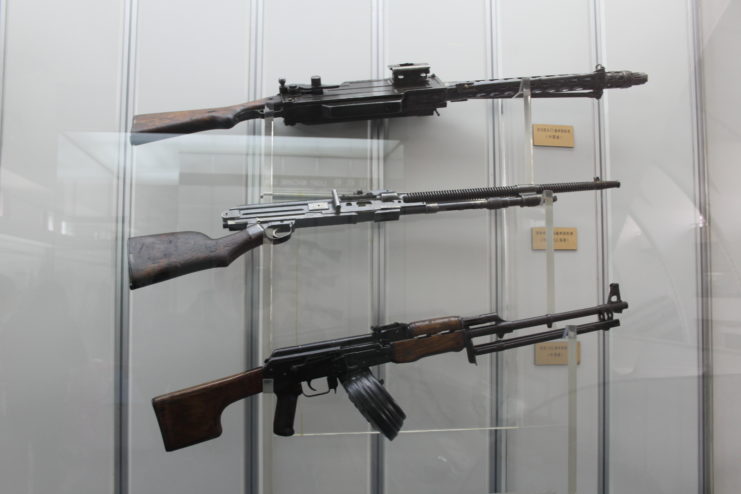 Three automatic weapons on display, with the Maxim-Tokarev placed at the top