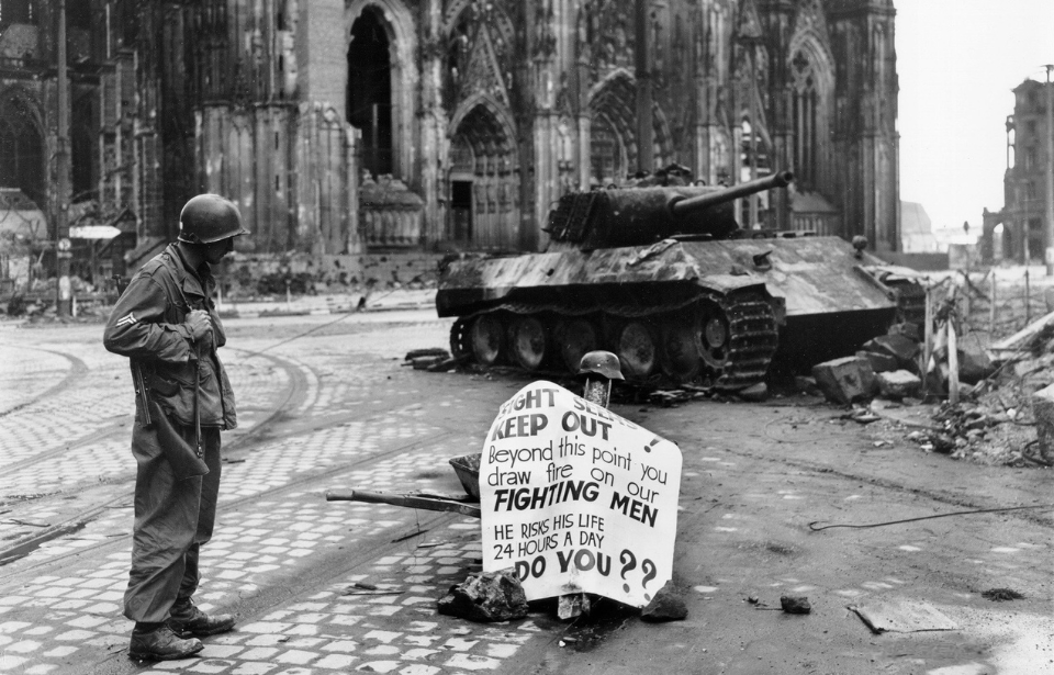 Soldier standing near the cathedral in Cologne's city center