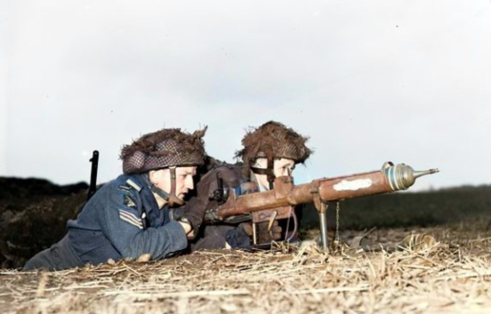 Pvt. L.H. Johnson and Sgt. D.R. Fairborn manning a PIAT anti-tank gun