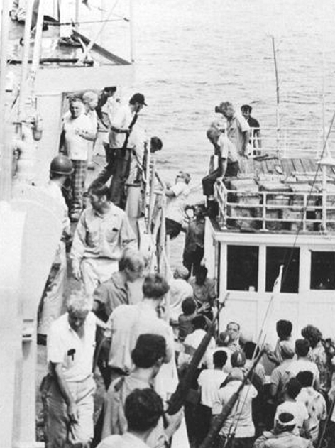 Crew of the SS Mayaguez boarding the USS Henry B. Wilson (DDG-7)