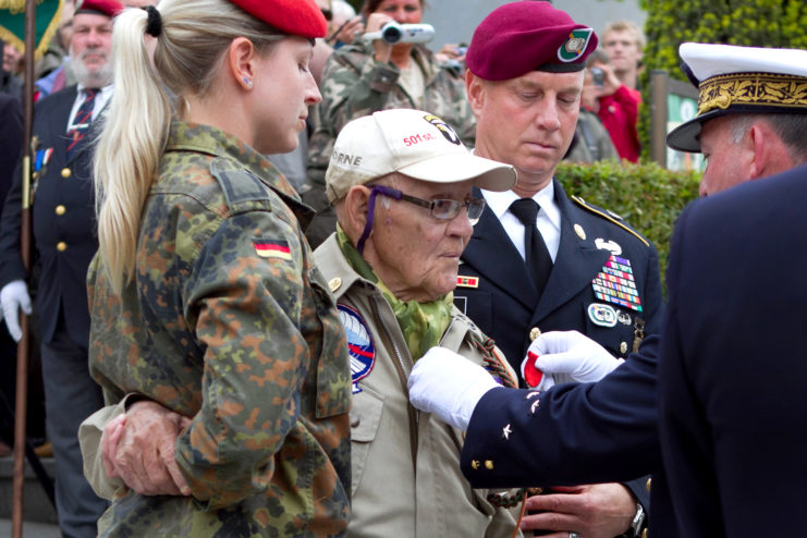 French military official pinning the Legion of Honour onto Robert Wright's chest