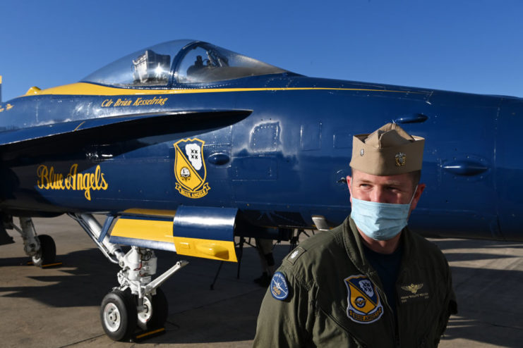 Frank Weisser standing next to a McDonnell Douglas F/A-18 Hornet flown by the Blue Angels